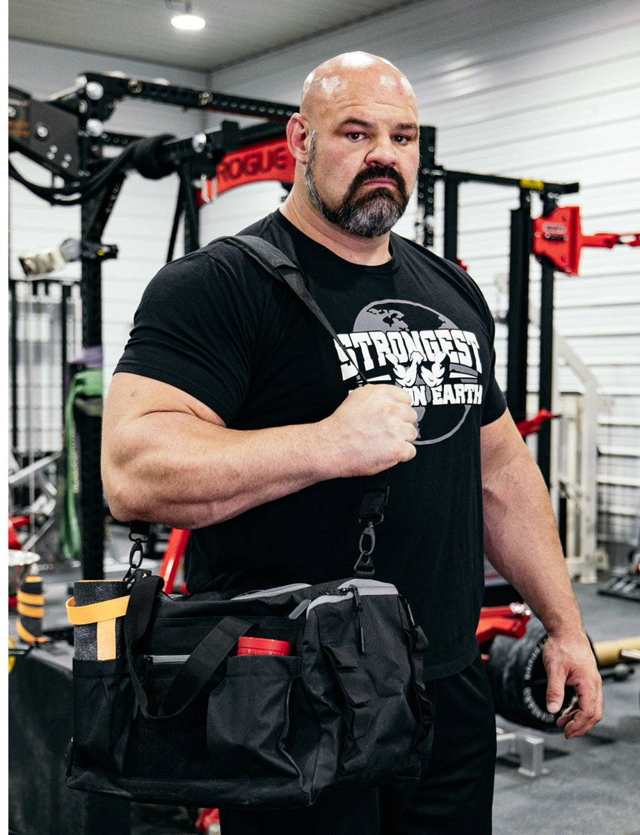 STRONGEST ARM ON EARTH Gym Duffel Bag by Brian Shaw