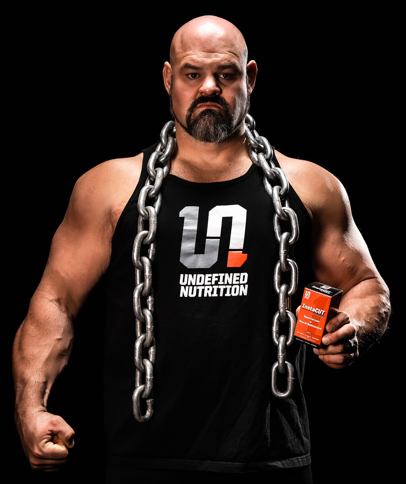 Brian Shaw holding Undefined Nutritions fat burning product instacut