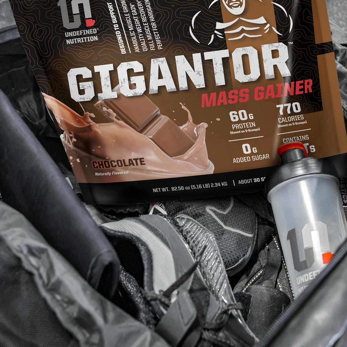 Gigantor Mass Gainer protein powder package with a scoop in an open bag