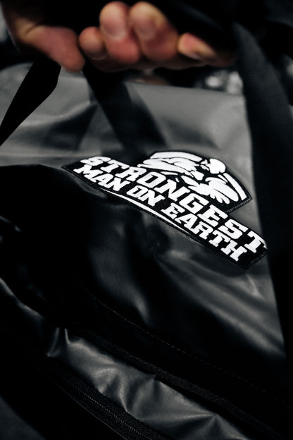 STRONGEST MAN ON EARTH ROLLER BAG