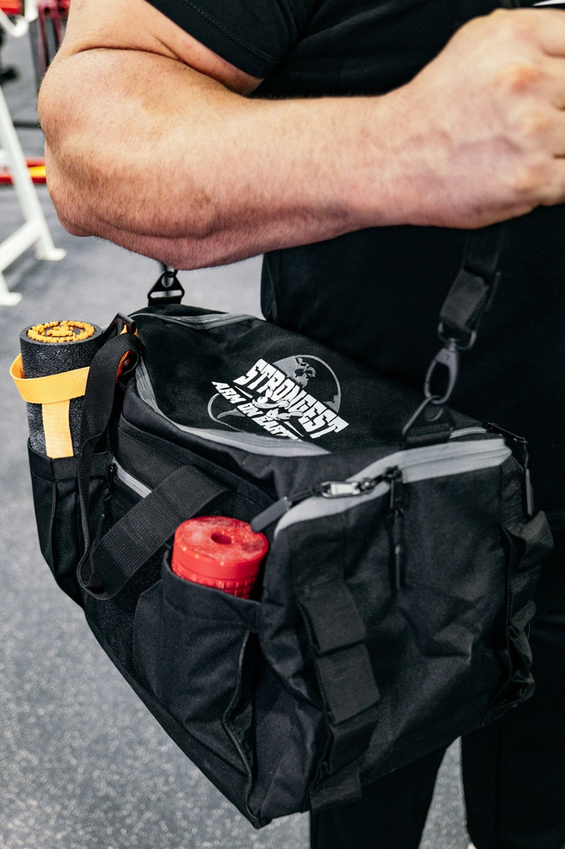 STRONGEST ARM ON EARTH Gym Duffel Bag by Brian Shaw