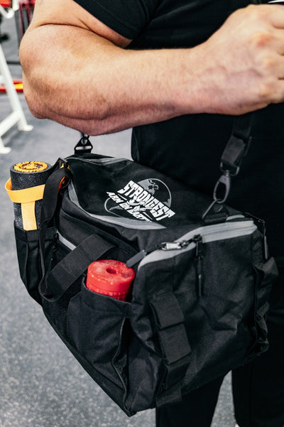 STRONGEST ARM ON EARTH Gym Duffel Bag by Brian Shaw