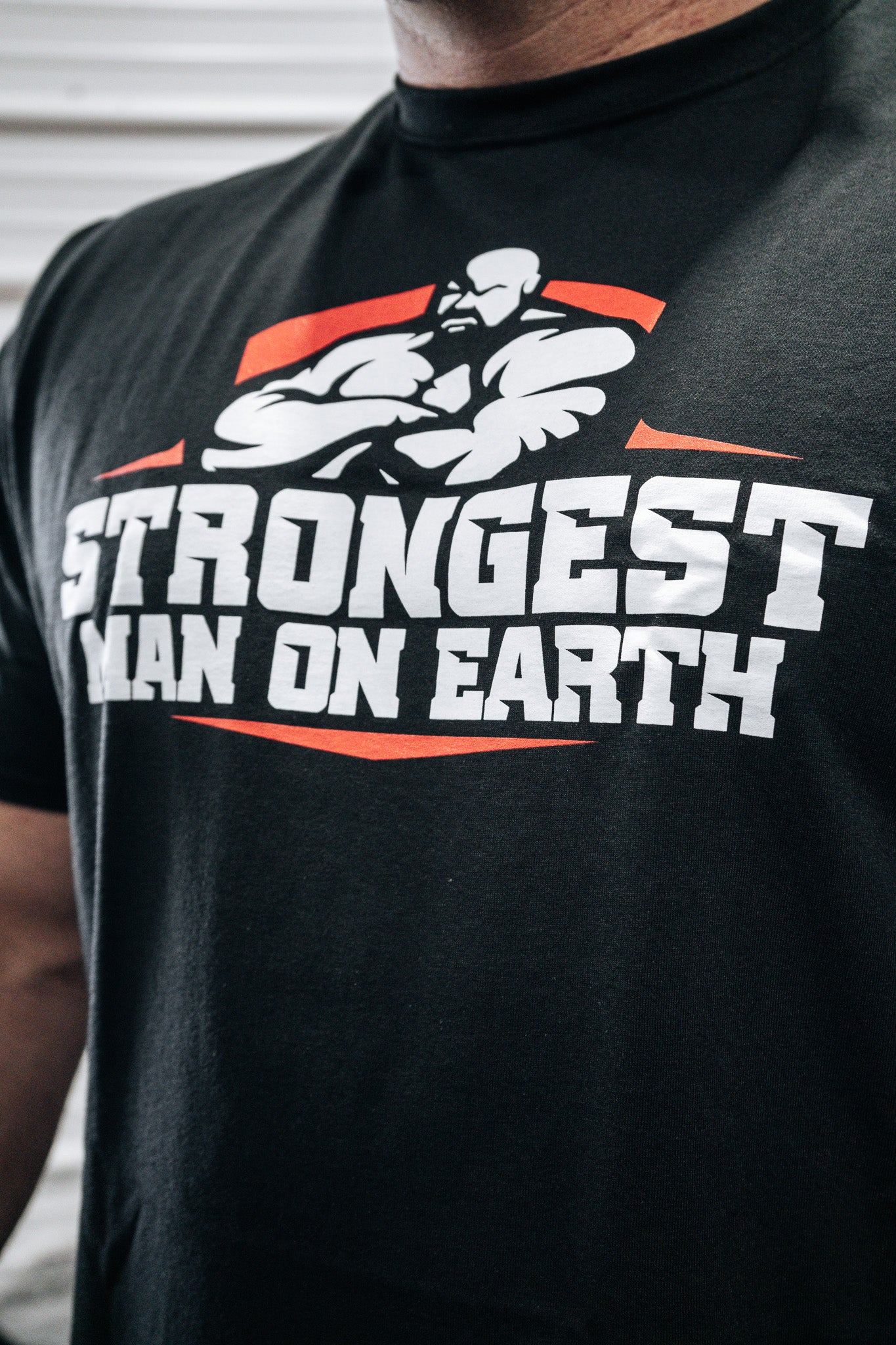 STRONGEST MAN ON EARTH RED SHIRT