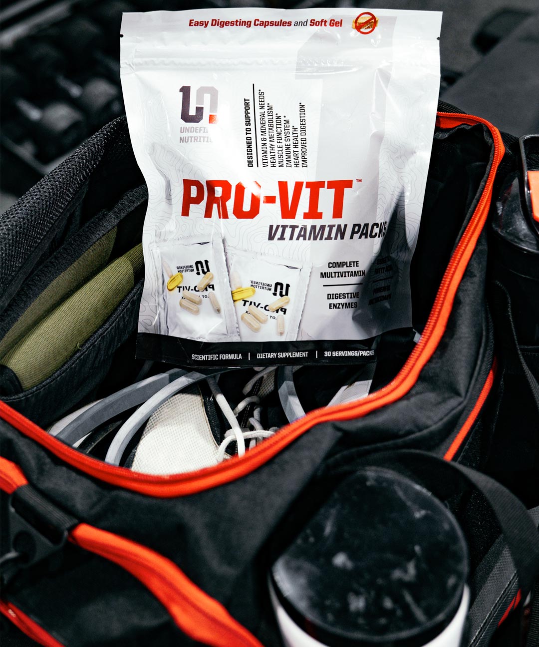 Pro-Vit vitamin pack inside a black and red backpack