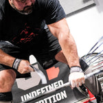 Brian Shaw lifting weights with a focus on fitness and strength training.