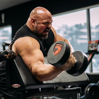Brian Shaw lifting weights in a gym setting